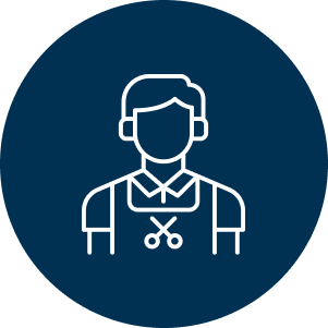 A blue circle icon with white outlines of a person with short hair wearing an apron featuring scissors, symbolizing a barber or hairdresser.