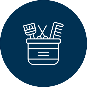 A dark blue circle with a white line graphic of a bucket containing hair tools, including a brush, scissor and comb, symbolizing haircut.